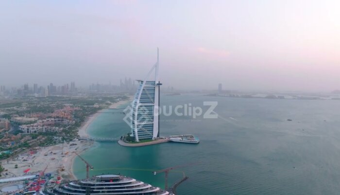 Smooth Drone Footage Dubai Flight Capturing Burj al Arab at Golden Hour Light