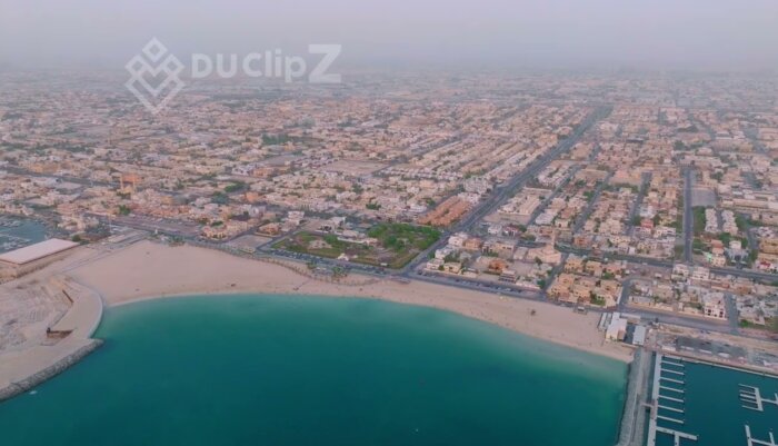 Free 4K Drone footage Dubai - Panorama Over Burj al Arab at Sunrise with Turquoise Waters