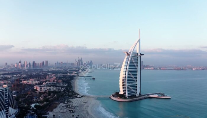 Smooth Drone Flyover of Burj al Arab with Turquoise Waters Below - Burj al Arab drone footage