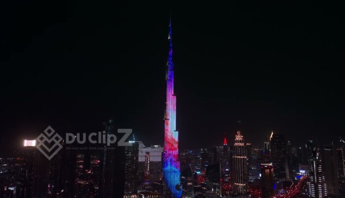 Smooth 4K Drone Flyover of Buji Khalifa at Night with City Lights