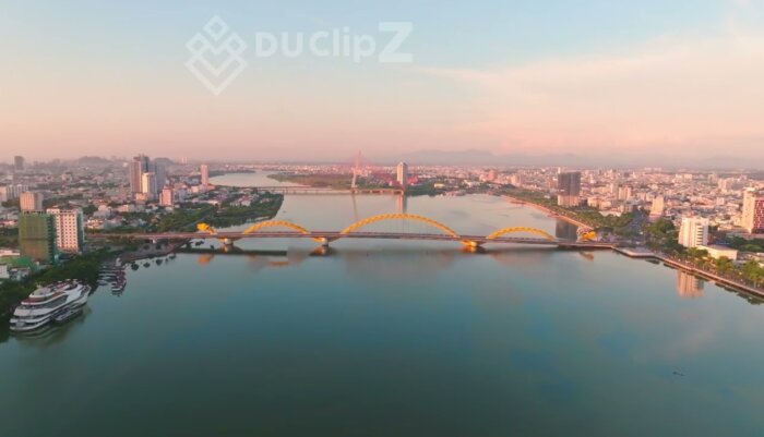 Smooth 4K Drone Footage Capturing Da Nang Dragon Bridge at Sunrise