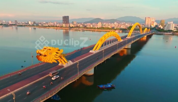 Cinematic 4K Drone Flyover of Da Nang Dragon Bridge and River Landscape