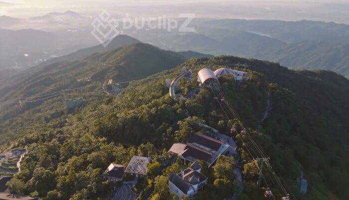 Smooth Aerial 4K Views of Da Nang Golden Bridge with Turquoise Waters
