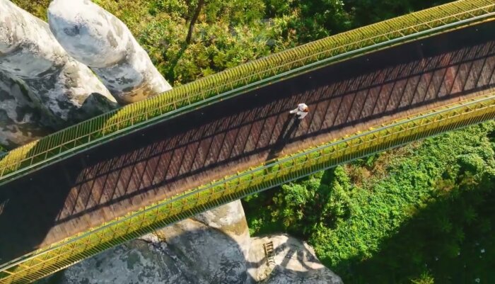 Serene 4K Drone Views of Da Nang Golden Bridge and Surroundings with Model walking
