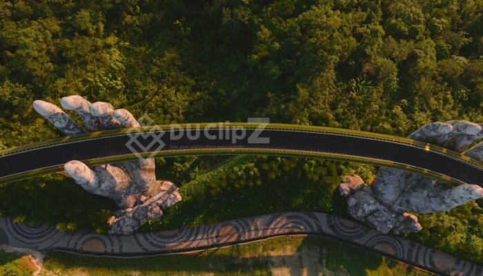 Smooth 4K Aerial Footage of Da Nang Golden Bridge Surrounded by Nature