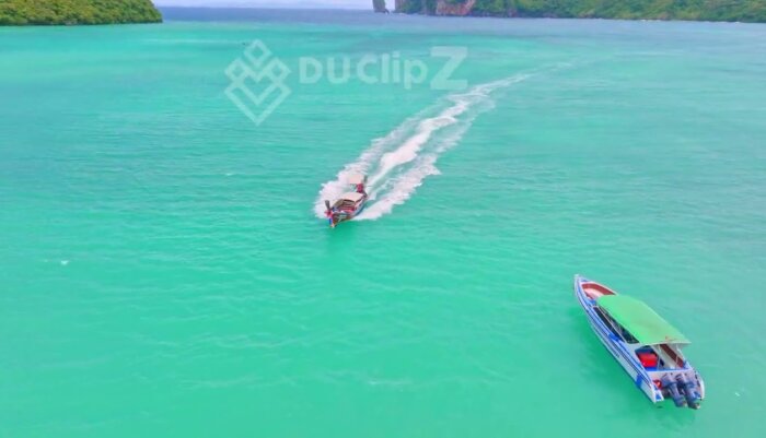Drone Footage of Boat Gliding Over Koh Phi Phi Emerald Waters
