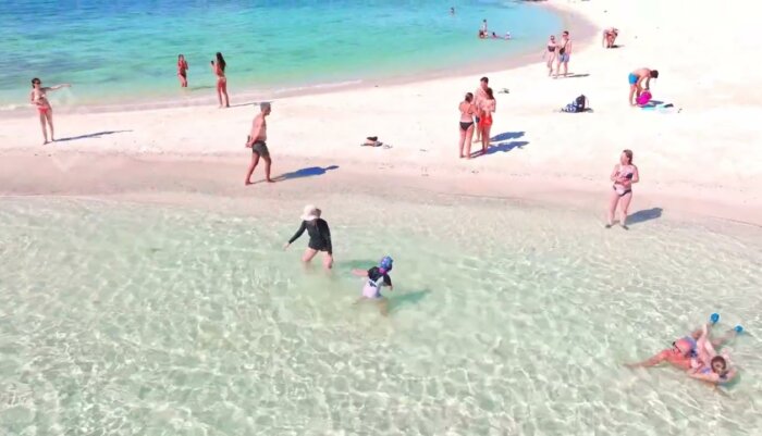 Vibrant Beach Scene with Tourists Playing on White Sands in Krabi | Thailand Video Footage