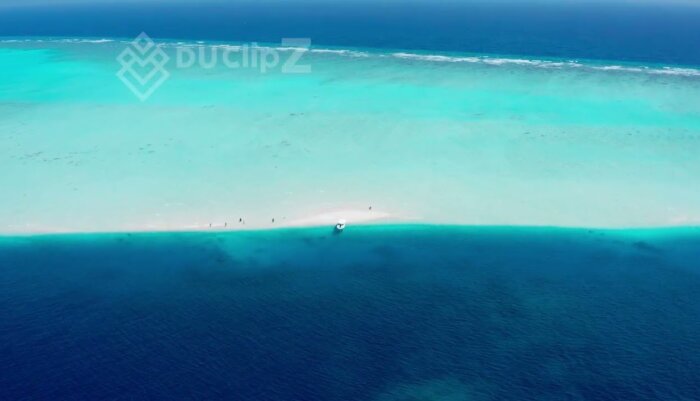 Maldives Sandbank Drone Footage Featuring Turquoise Waters and Island