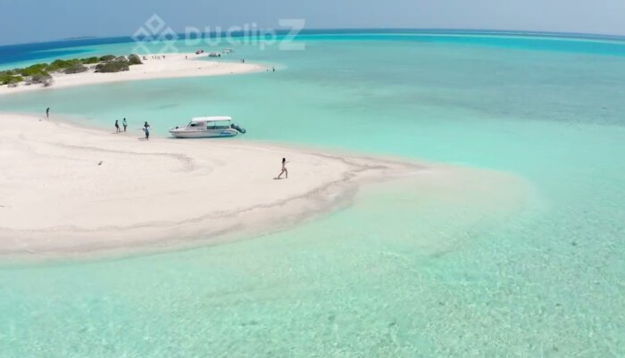 Drone Footage of Maldives Sandbar Highlighting Turquoise Ocean and Island