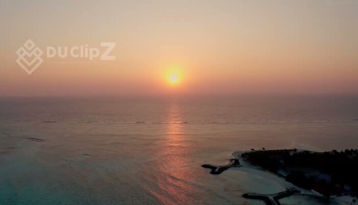 Maldives Sunset Drone Footage - Glow Over Maldives Sandbank and Turquoise Waters