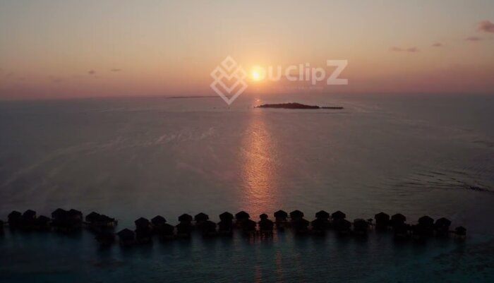 Maldives Resort Sunset with Turquoise Waters and Soft Ocean Waves