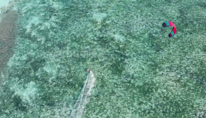 Dynamic Kite Surfing Action Over Maldives’ Crystal Clear Blue Waters