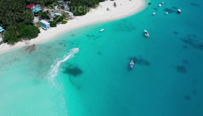 Stunning Maldives Island with Crystal Clear Blue Waters in 4K Drone