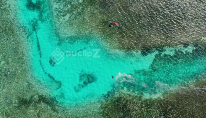 Kitesurfing at Maldives with clear blue water from drone | 4k Video Stock Footage