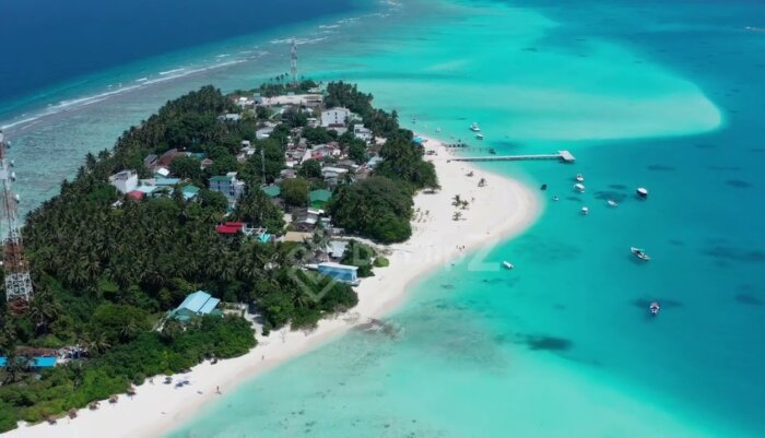 Serene Maldives Island with Crystal Clear Waters in Smooth 4K Drone stock