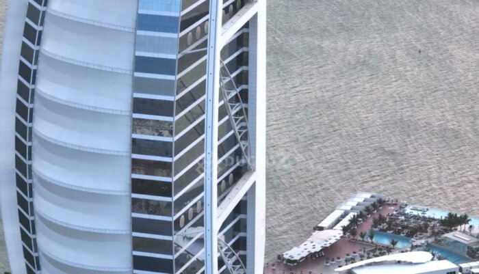 Smooth Drone Flyaround of Dubai’s Buji al Arab Hotel with Ocean Views