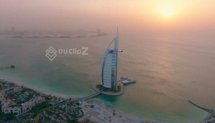 Golden Hour Drone footage Flyover of Burj al Arab with Stunning Sunrise Light