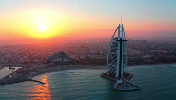 Smooth Burj al Arab Sunrise Drone Footage with Warm Golden Light