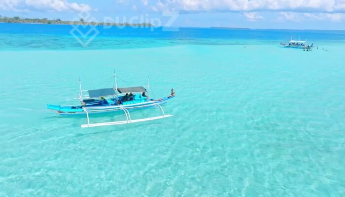 Drone Footage of Balabac -  Aerial View of Balabac’s Clear Ocean and Island Sandbanks with Boat