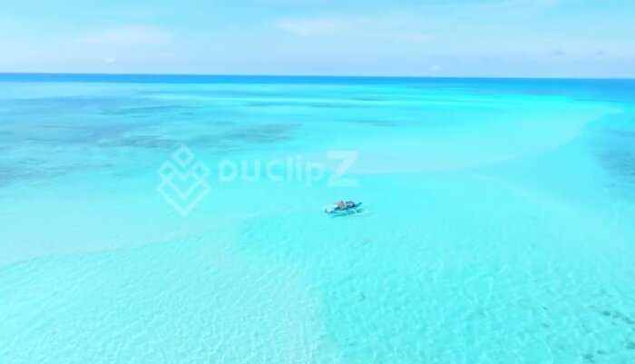 Smooth Drone Glide Over Balabac’s Vibrant Ocean with Boat - Balabac Drone Footage