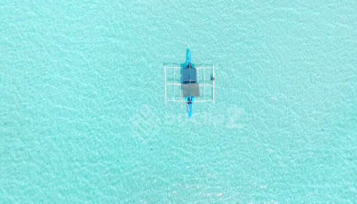 Drone Captures Boat Gliding Over Balabac’s Jade Green Waters