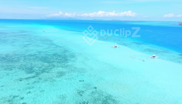 Smooth Drone Flight Over Balabac Clear Blue Waters and Sailing Boat